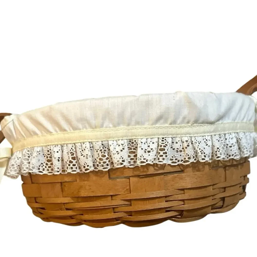 Longaberger Round Basket 10”with leather handles lace trim liner 1990 signed.